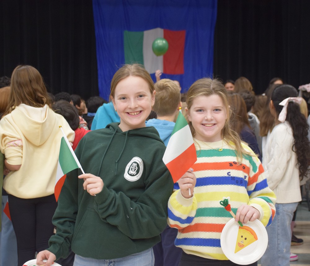 Locust Valley Intermediate students Holden Higgs and Hadley Austin waved Italian flags as they departed Italiamo.
