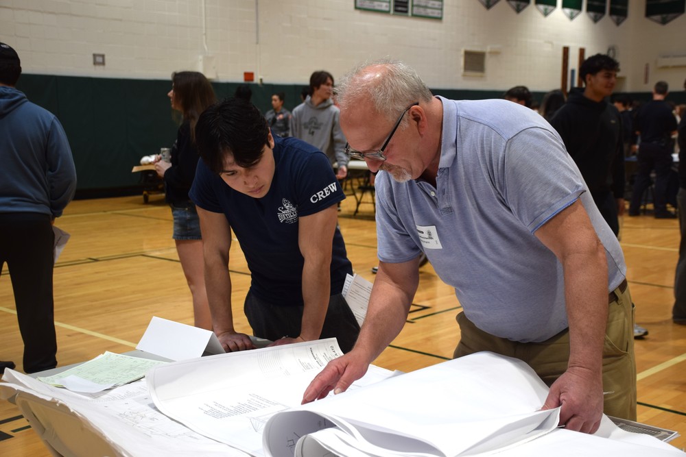 A LVHS student speaks to an experienced architect at the 2026 career fair.