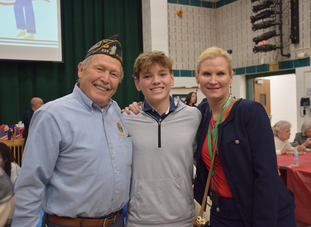 Superintendent of Schools, Dr. Kristen Turnow, with a student and veteran at the veterans luncheon in Nov. 2025.