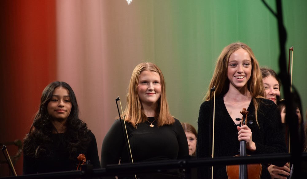 Locust Valley middle schoolers Isabella Anaya Avelar, Kenna Jadezuk and Tenley Walsh (left to right) received a standing ovation as part of the string orchestra.