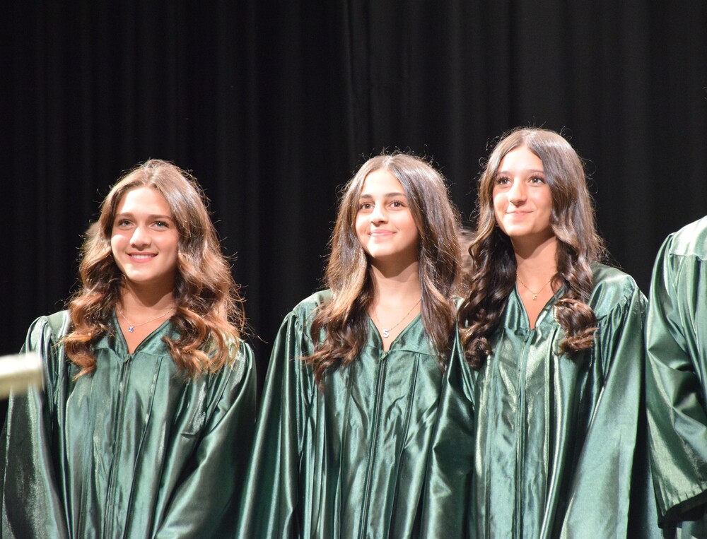 Eighth graders pose at the middle school moving up ceremony.