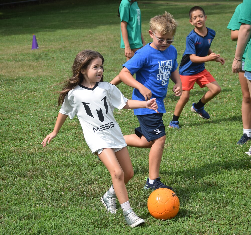 Summer Recreation campers play soccer on Fitness Fun Day 2026.