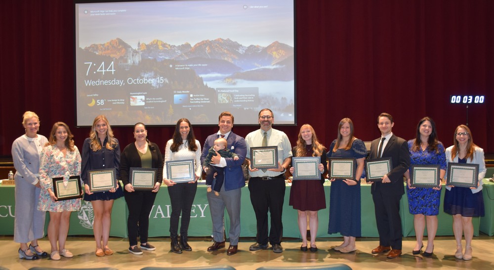 1)	Eleven Locust Valley educators were honored for achieving tenure at a ceremony on Oct. 15.