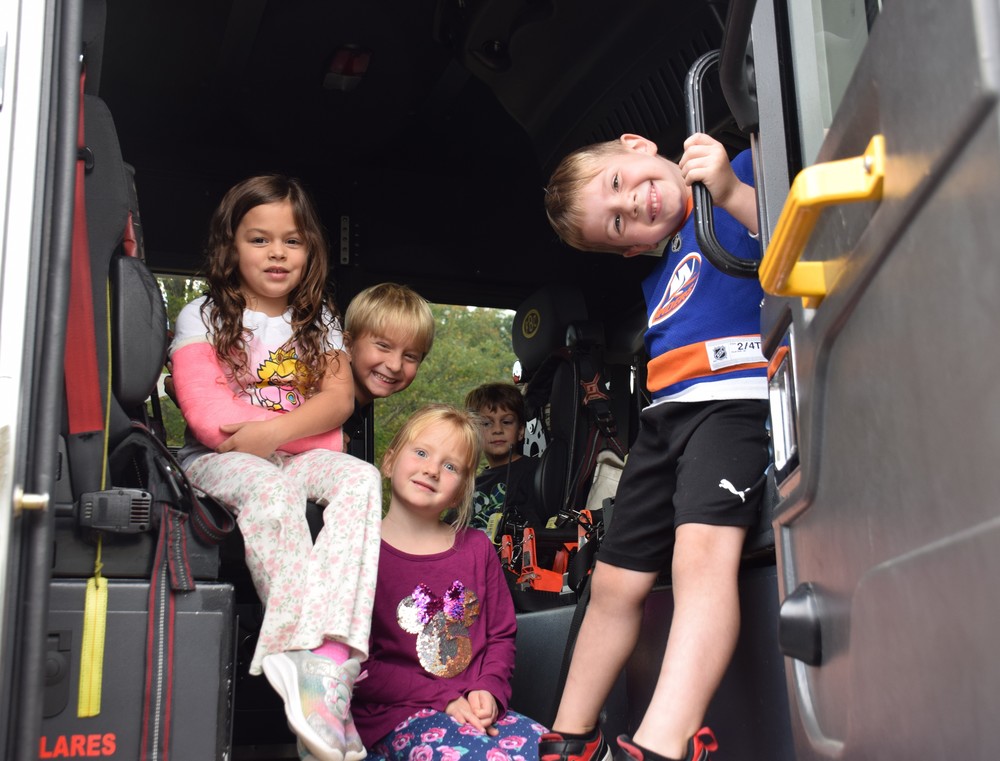 Bayville Primary students in the Bayville Fire Department fire engine.