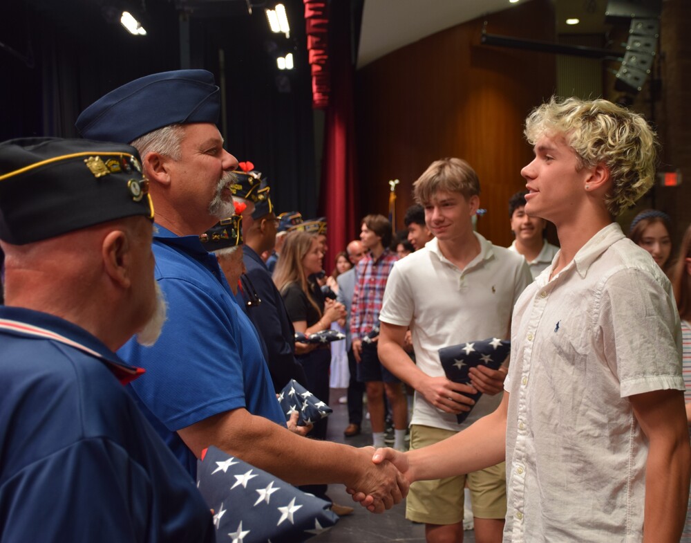 Locust Valley High School senior Gavin Boyd greeted and thanked a veteran from the Bayville American Legion post during the school’s Legacy of Service event on June 3.