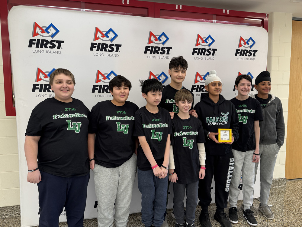 Members of the Locust Valley Middle School robotics team, Falconbots, celebrated with a trophy after winning the Engineering Excellence Award at the FIRST Lego League qualifiers on Jan. 24.