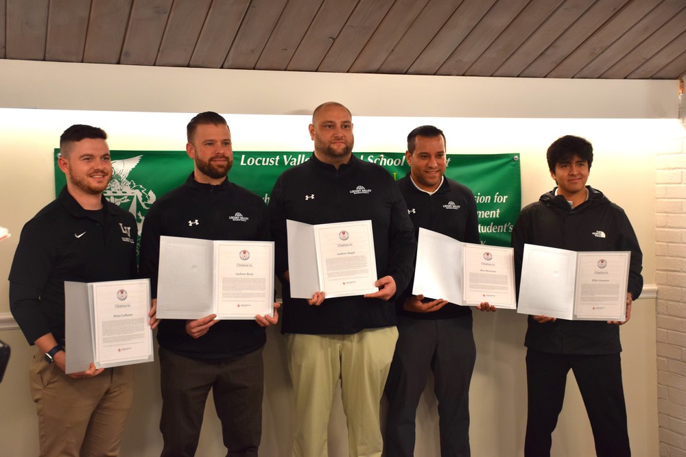 Locust Valley High School coaches Brian Lorusso, Andrew Bock, Andrew Siegel, Ben Martinez and Elliot Aramayo (left to right) showed their Lifesaving Awards certificate from the American Red Cross.