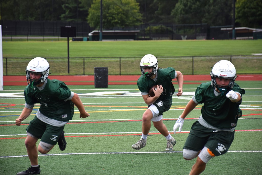 A Falcons running back follows his blockers.