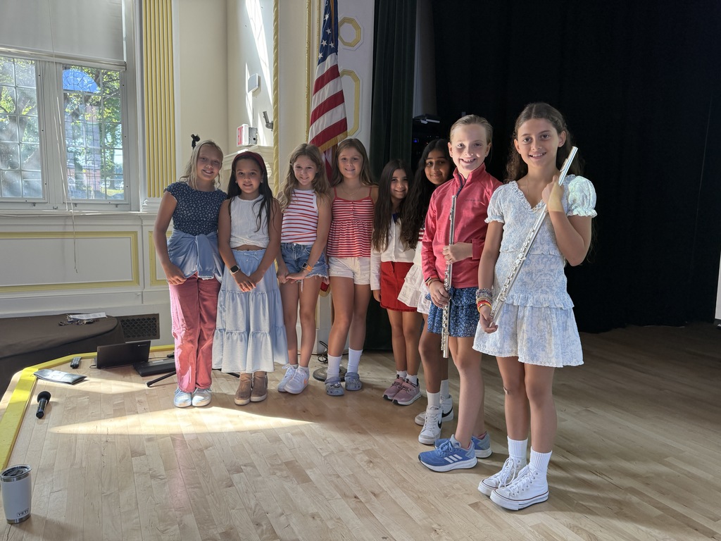 Locust Valley Intermediate’s Louise Vaughn, Elle Franciotti, Emily Wolf, Margot Pereira, Maria Ambrosino, Raya Hassan, Holden Higgs and Elle Minutoli (left to right) performed at the school’s Patriot Day ceremony.