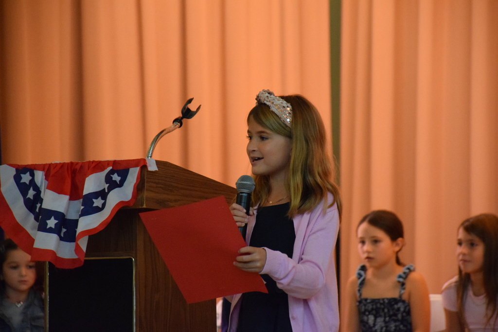 A Bayville Intermediate student council member gives a speech to the crowd.