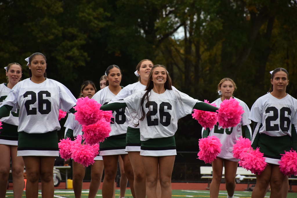 The high school cheerleading team performed at halftime.