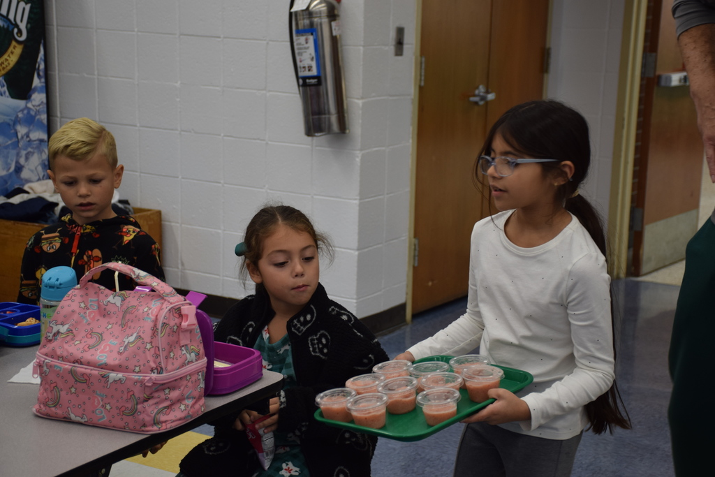 Bayville Primary School students try out the strawberry banana smoothies.