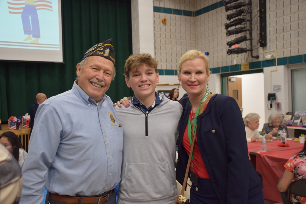 4)	Veteran James E. MacDonald, Locust Valley High School student James Fox and Superintendent of Schools Dr. Kristen Turnow met at the veterans luncheon.