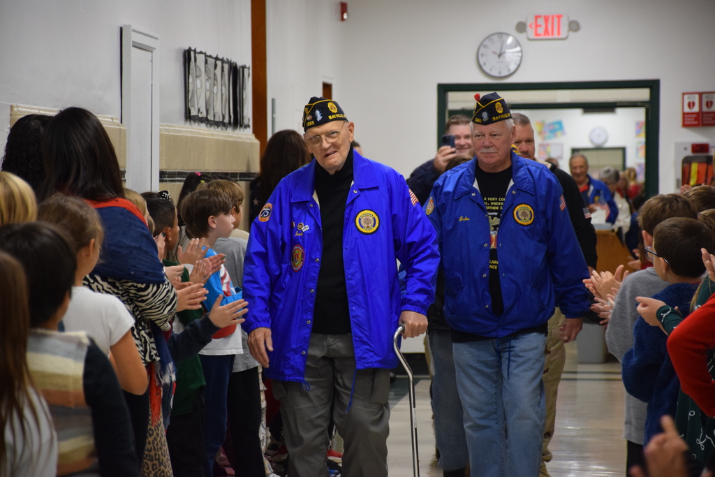 2)	Veterans were welcomed to Locust Valley Intermediate School by students for a ceremony in the auditorium.
