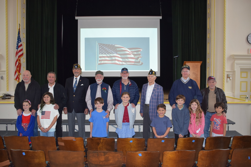 2)	Veterans were welcomed to Locust Valley Intermediate School by students for a ceremony in the auditorium.