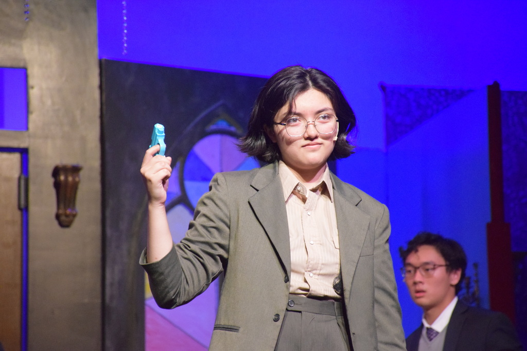 Mr. Green displays his weapon.