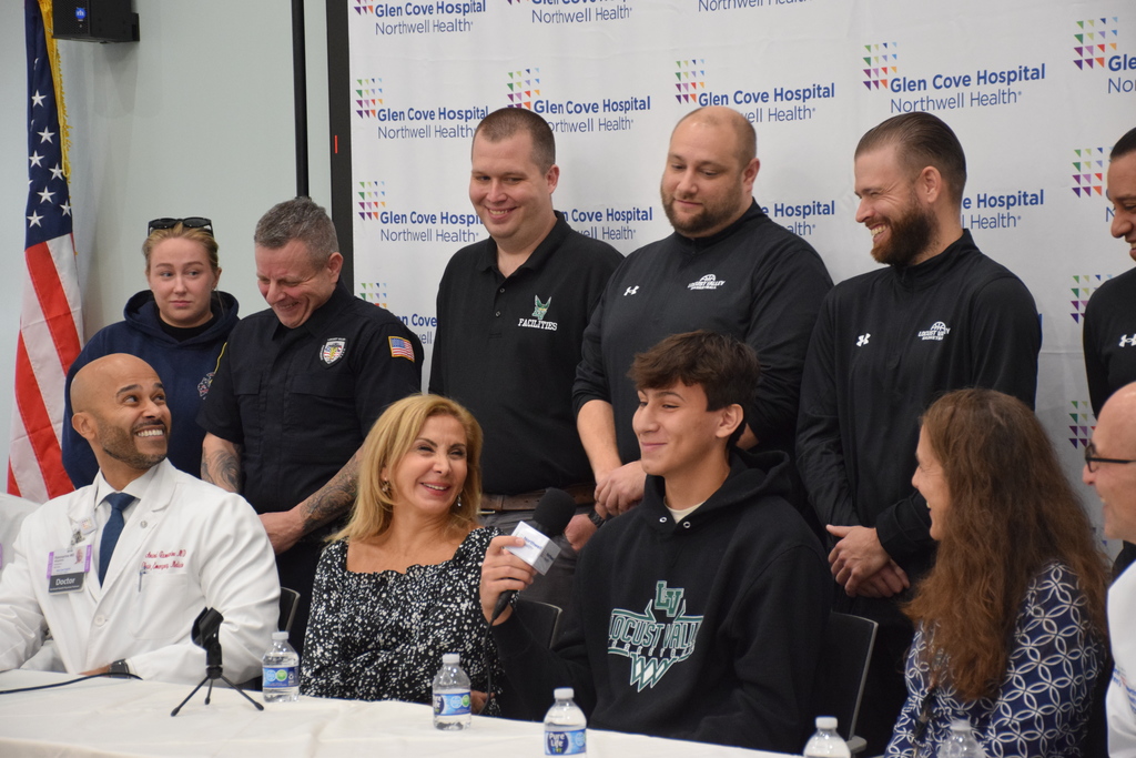 1)	Locust Valley High School student Francesco Allocca spoke about his gratitude surrounded by his mother coaches, nurses and doctors.