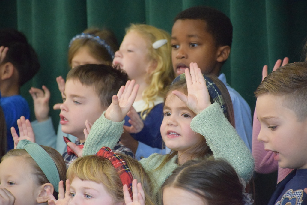 Students at AMP perform Thanksgiving songs.