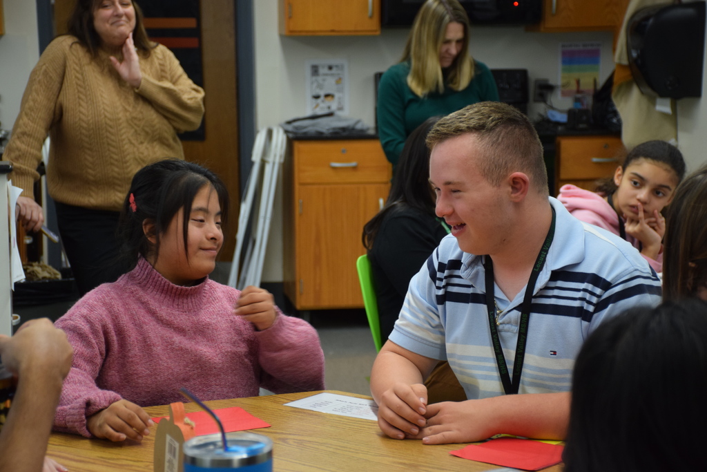 High schoolers enjoy Thanksgiving lunch.