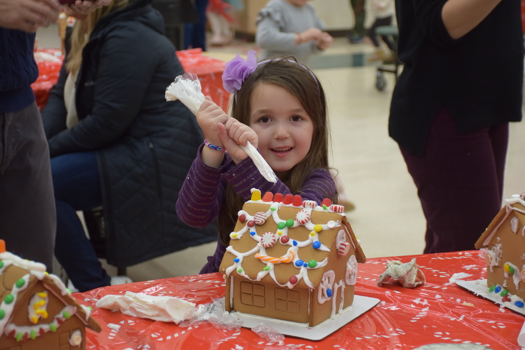 A student at Ann MacArthur Primary School decorates her gingerbread house at the LVEPC event on Dec. 5/