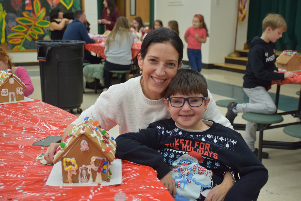 An Ann MacArthur Primary student created a gingerbread house with his mother.