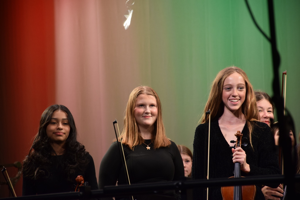 Locust Valley middle schoolers Isabella Anaya Avelar, Kenna Jadezuk and Tenley Walsh (left to right) received a standing ovation as part of the string orchestra.