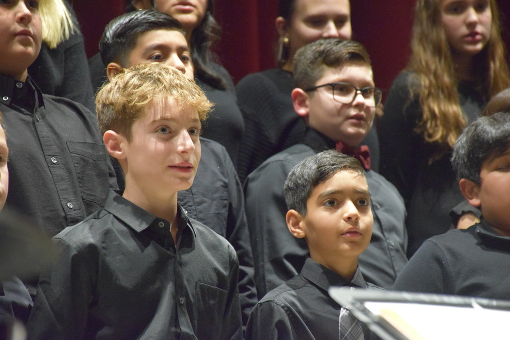 Middle school students in the chorus serenade the audience.