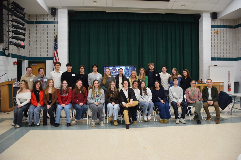 The Locust Valley High School alumni with their IB teachers Coleen Comerford and Anthony Vitale.