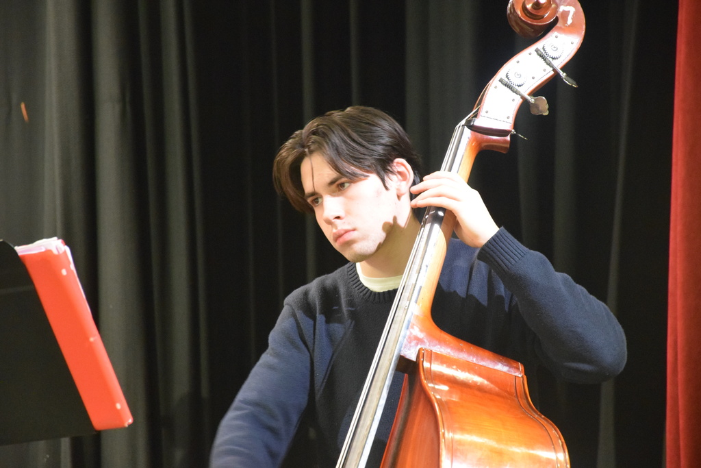 A Locust Valley High School student played the bass at the concert.