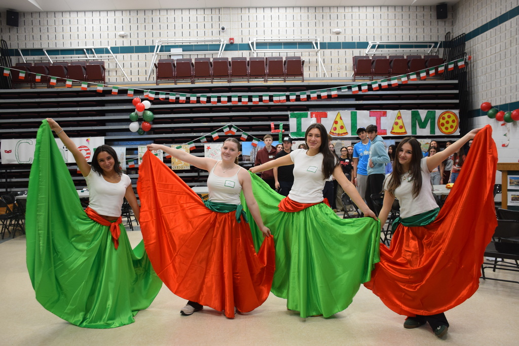 Locust Valley High School students Cristina Villella, Abby Madden, Emily Gallo and Mia Marcantonio wore colorful Italian dresses as they taught students how to dance “La Tarantella.”