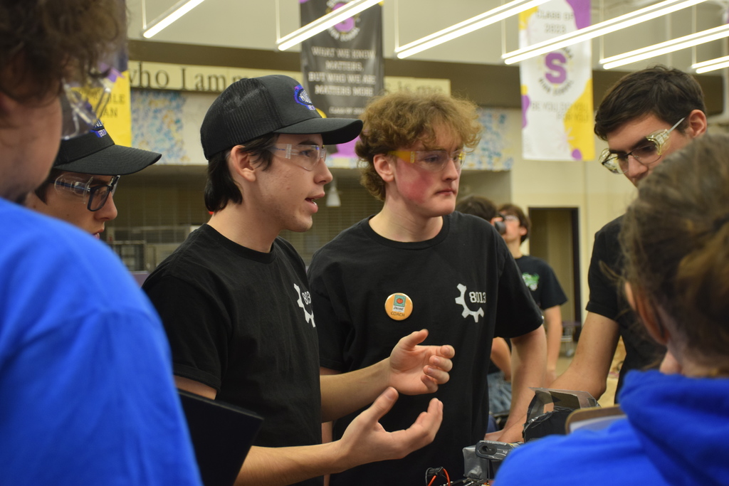 Members of Kuiper, Nicholas Vebeliunas and Henry Brown explained the process of building their robot to the FIRST judges.