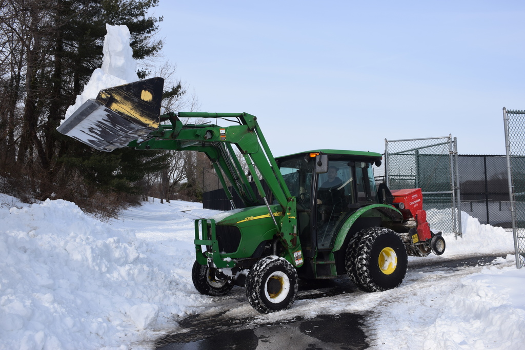 The grounds crew working at the MS/HS.