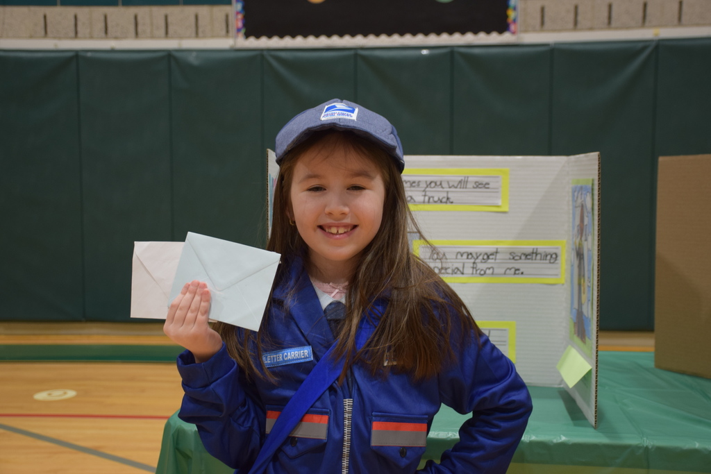 A Bayville Primary second grader showcases her mail carrier display.