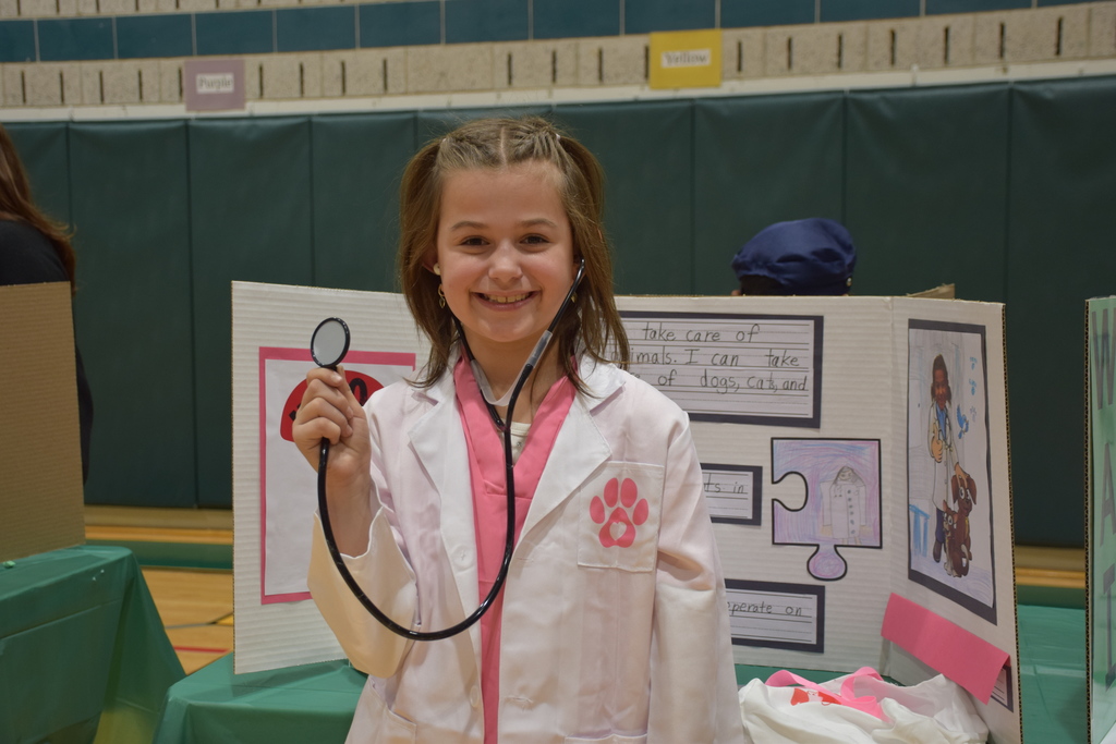 A Bayville Primary second grader showcases her veterinarian display.