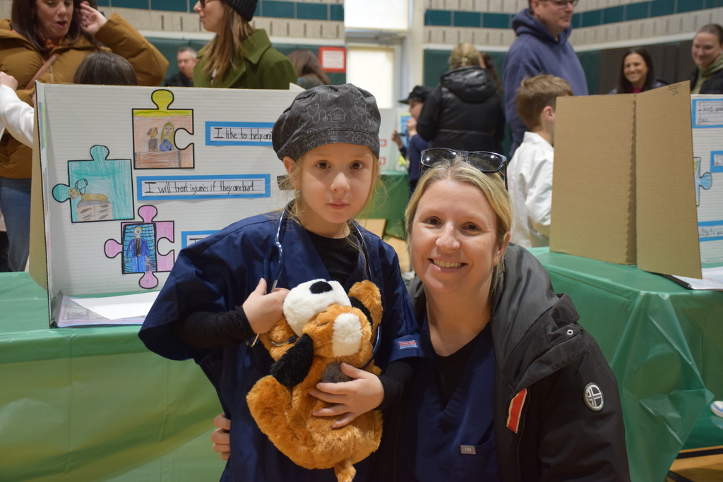 A Bayville Primary second grader and her mother show classmates the veterinarian display.