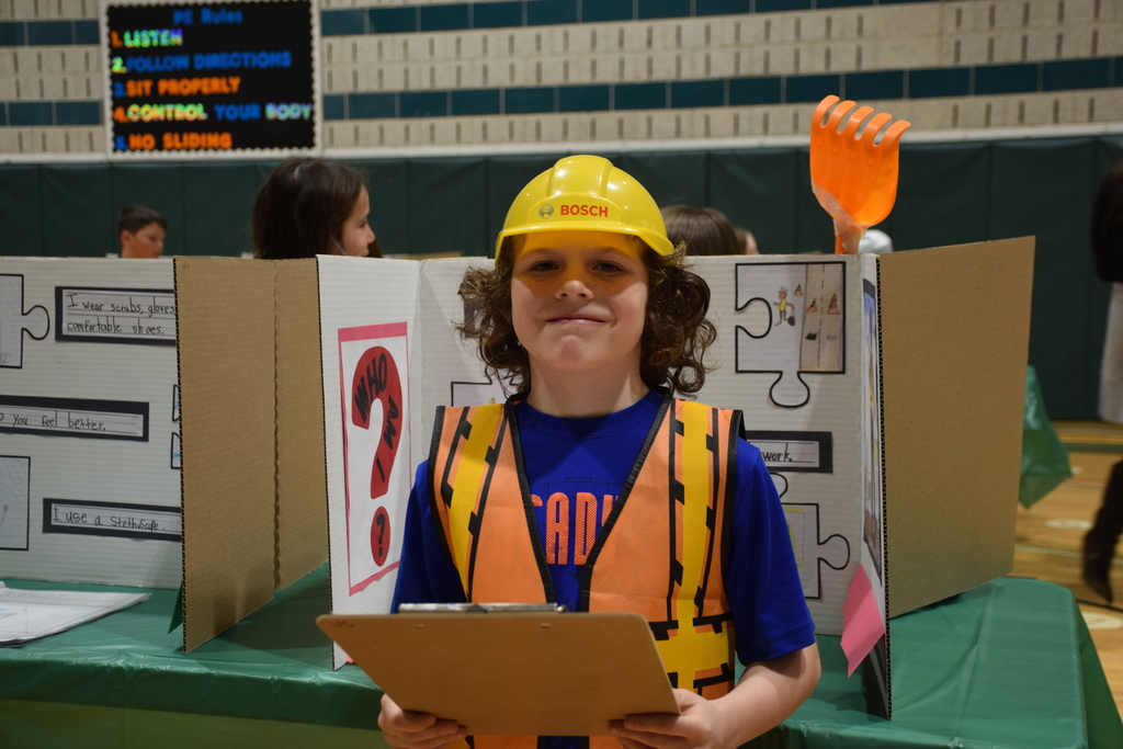A Bayville Primary second grader showcases his construction display.
