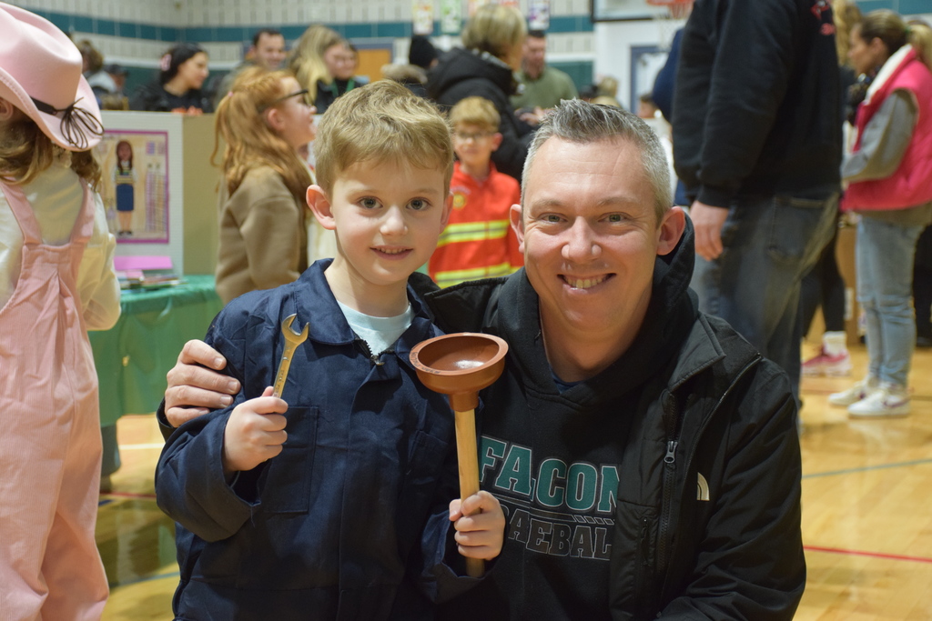A Bayville Primary School student greets his guest.