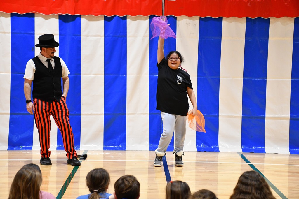 Fifth grader Brianna Torres posed for the crowd after completing her juggling act.