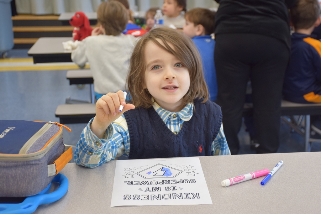 A BP student works on his positive message for a teacher.