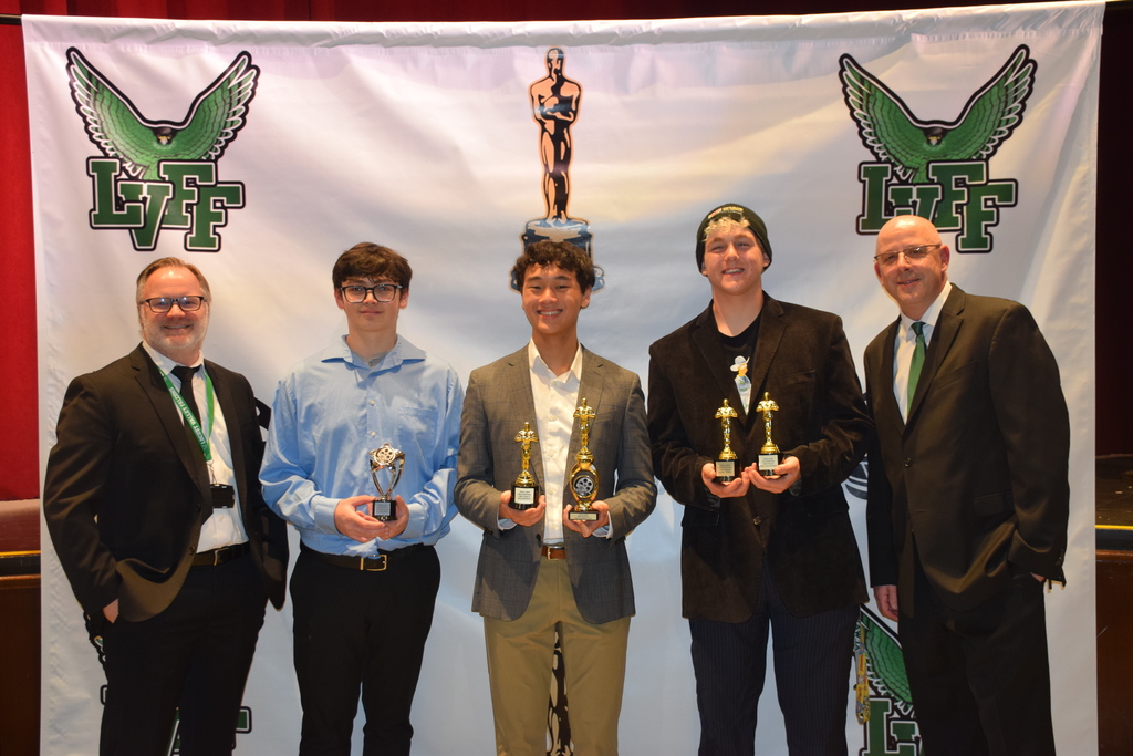 Locust Valley High School film teacher Jacob Cooney, students Raffaele Gianatassio, Justin Kwok and Dean Wolfe and film teacher Roger Boucher celebrated several awards, including best overall film, for the music video “Money Game.”