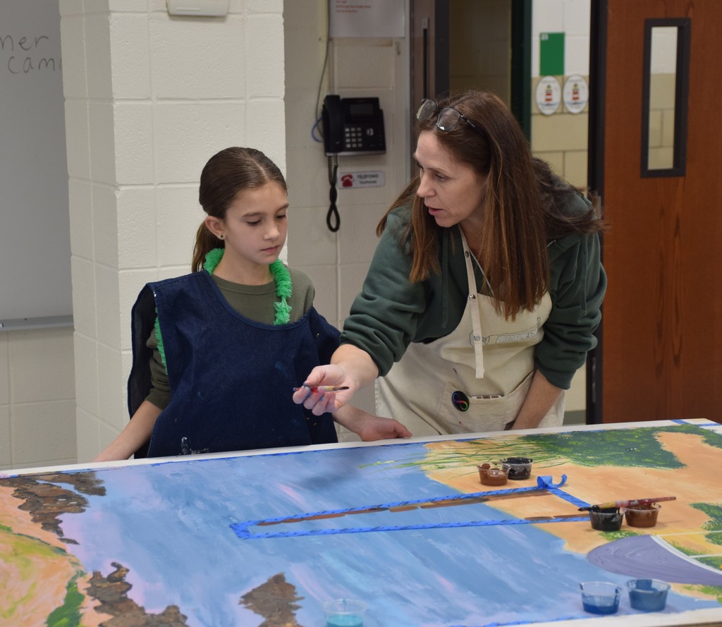Mrs. Chaplin helps a student.