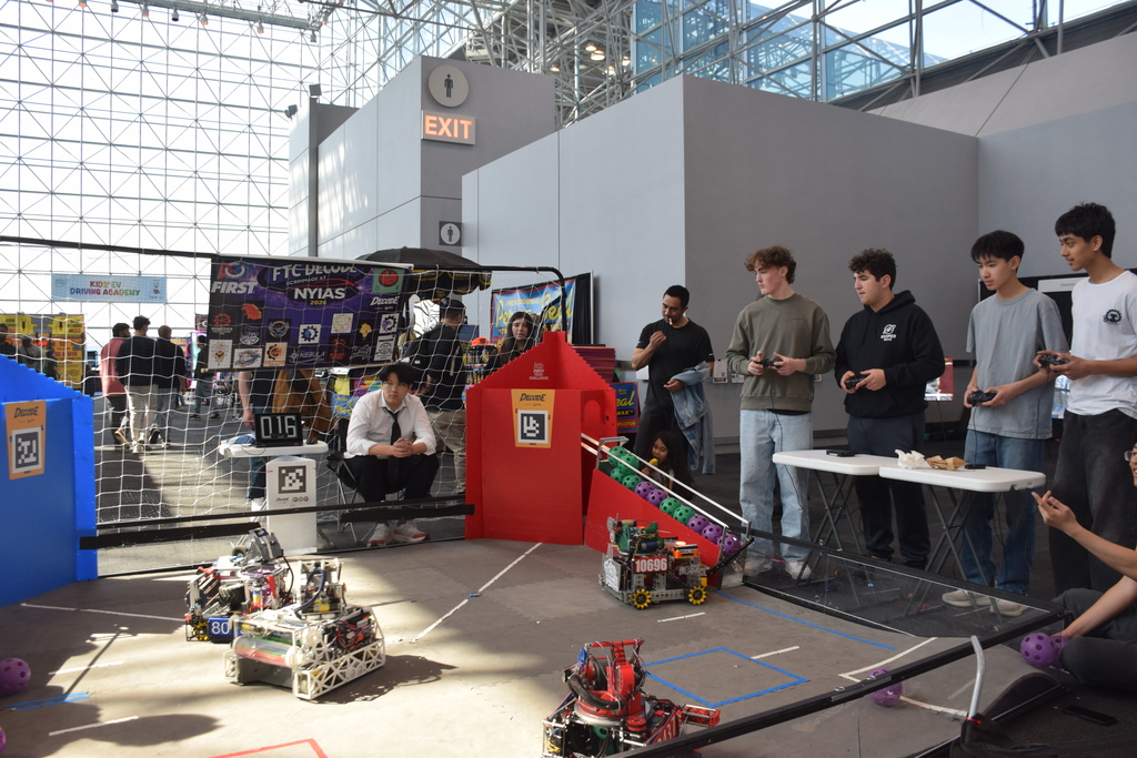 Team Kuiper members Luca Russo and Henry Brown conducted a scrimmage with other local robotics teams to show guests how high school robotics competitions work.