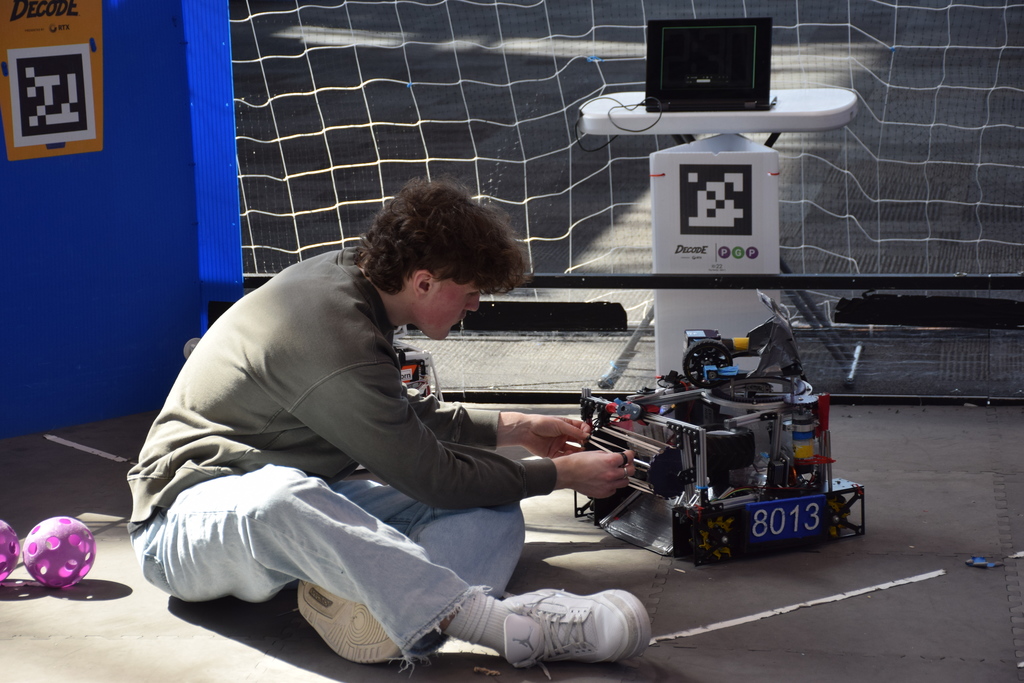 Locust Valley High School student Henry Brown worked on Team Kuiper’s robot at the New York International Auto Show.