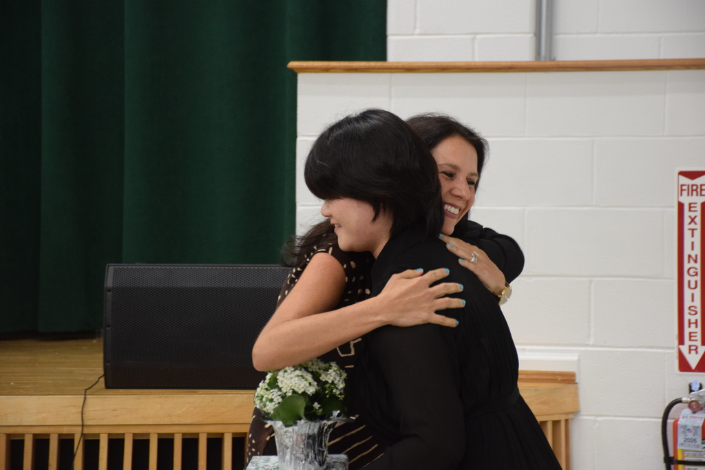 Abigail Vuong thanks faculty member Tiffany Ruffo-Scott at the Top 15 ceremony in 2026.