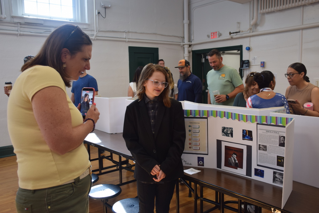 Bayville Primary School student Kay Hallock presents her project on Nikola Tesla.