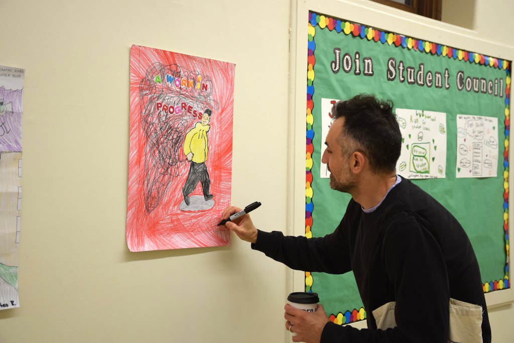 Jarrett Lerner signed renditions of his book covers made by LVI students.