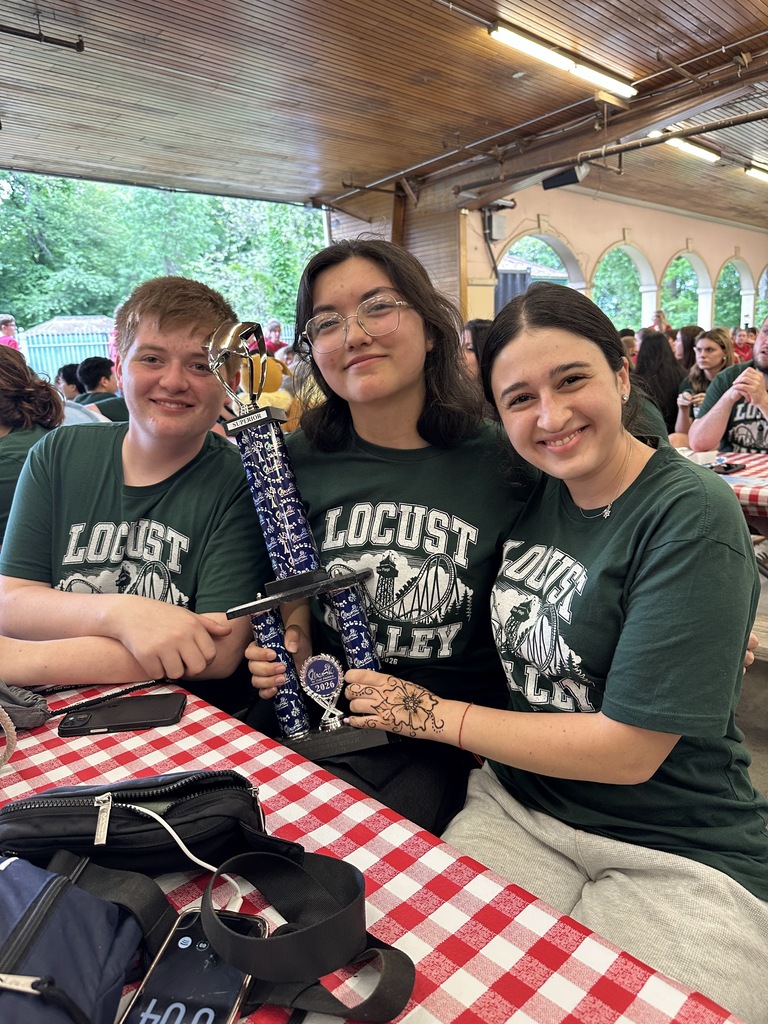Locust Valley High School students Chris Emmerich, Grace Araoz and Ava Yagudayev accepted the second-place trophy for the concert chorale.