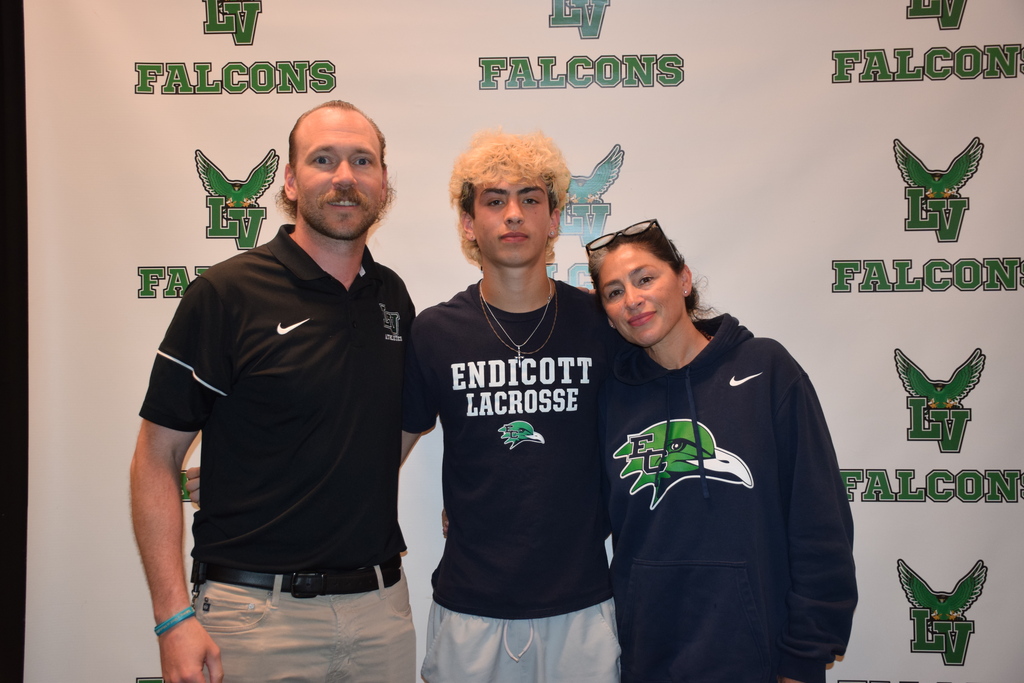 Coach Tom Duggan, Byron Hafner and his mother at college signing day 2026.
