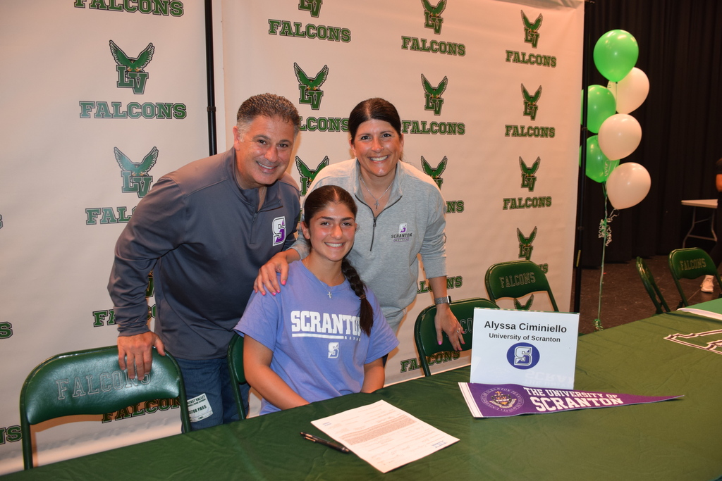 Alyssa Ciminiello with her parents on college signing day 2026.
