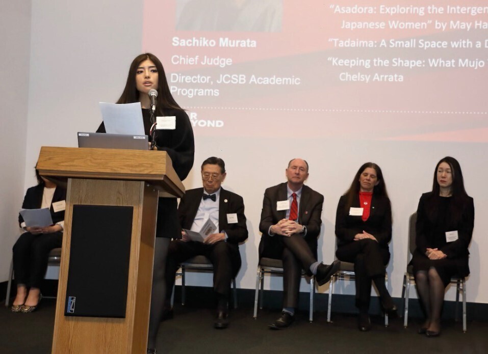 Chelsy Arrata gives a speech after winning first place in the 2026 Japan Center Essay Competition.